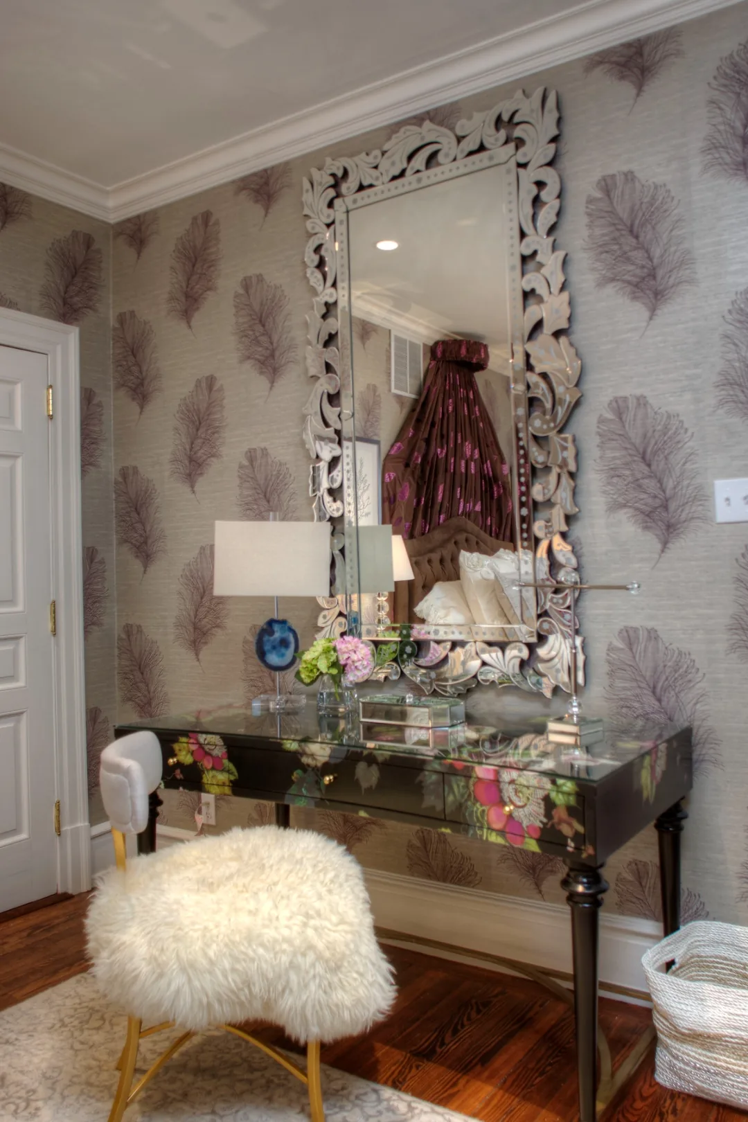 Mirrored dressing table with an ornate Venetian mirror, agate lamp, and fur stool in the Cape May ensuite bedroom